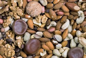 Square background of different kinds of nuts